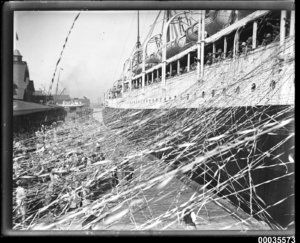 SS_CERAMIC_departing_the_White_Star_Line_wharf_at_Millers_Point,_with_crowds_and_streamers,_19...jpg