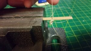 1159 Step 11 - On Model, Tie Coil to Railing with Overhad Knot.jpg