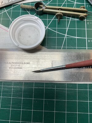 Water moisted cut edge before first fold.jpg Water moisted cut edge before first fold.jpg