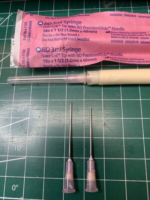 Syringe for glue and the needles.jpg