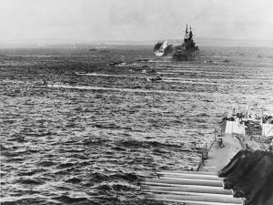 1280px-LVTs_move_toward_Saipan,_past_bombarding_cruisers,_on_15_June_1944_(80-G-231838).jpg