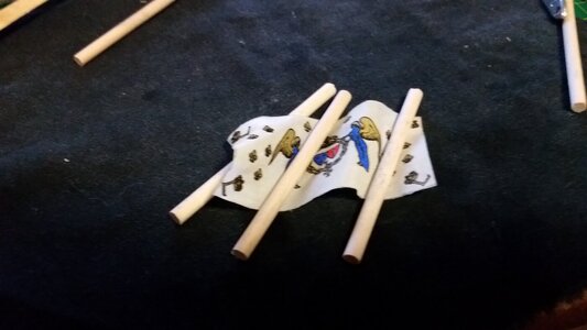 1337 Fold Flag Over Dowels and Dry With Hot Air Gun.jpg