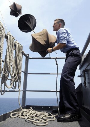 1024px-US_Navy_080730-N-7571S-010_Quartermaster_Seaman_Andrew_Dobrzykowski_lowers_day_shapes_B...jpg