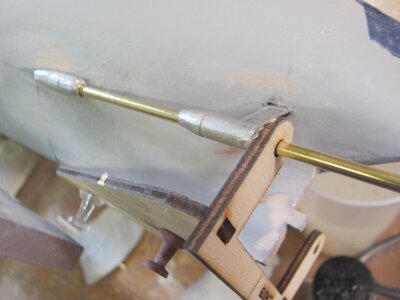 Propeller shaft aligned in boss and strut using jig.jpg