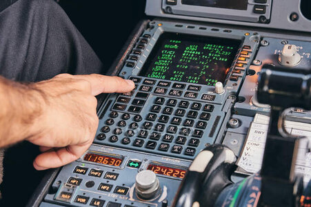 focused_373000702-stock-photo-crop-anonymous-male-pilot-using.jpg