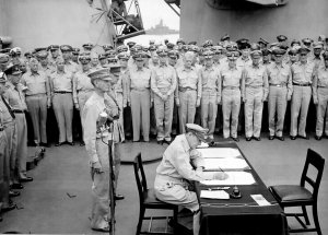 Douglas_MacArthur_signs_formal_surrender.jpg