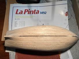 A wooden object on a table Description automatically generated A wooden object on a table Description automatically generated
