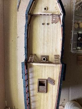 A model of a boat Description automatically generated A model of a boat Description automatically generated
