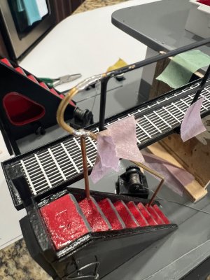 7 fisrt attempt soldering curbe to railings.jpeg