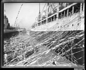 SS_CERAMIC_departing_the_White_Star_Line_wharf_at_Millers_Point,_with_crowds_and_streamers,_19...jpg
