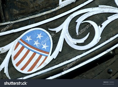 stock-photo-carving-of-the-stars-and-stripes-on-the-bow-of-the-uss-constitution-in-boston-harb...jpg