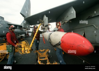 an-aviation-ordnancemen-uses-an-hlu-196ae-bomb-hoist-to-load-an-aim-7-sparrow-missile-aboard-a...jpg an-aviation-ordnancemen-uses-an-hlu-196ae-bomb-hoist-to-load-an-aim-7-sparrow-missile-aboard-a...jpg