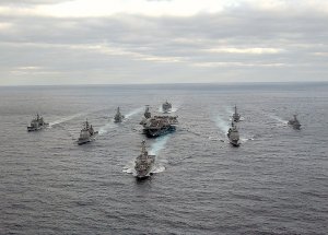 1024px-US_Navy_031130-N-3653A-002_USS_George_Washington_(CVN_73)_Carrier_Strike_Group_formatio...jpg